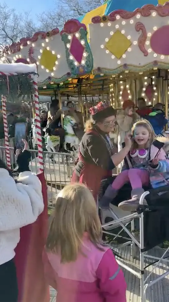 A girl getting her face painted.
