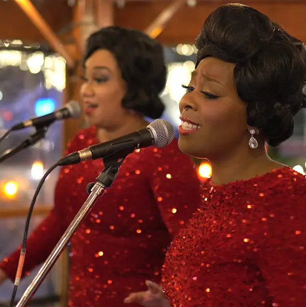 Two women singing at Seattle Christmas Market.