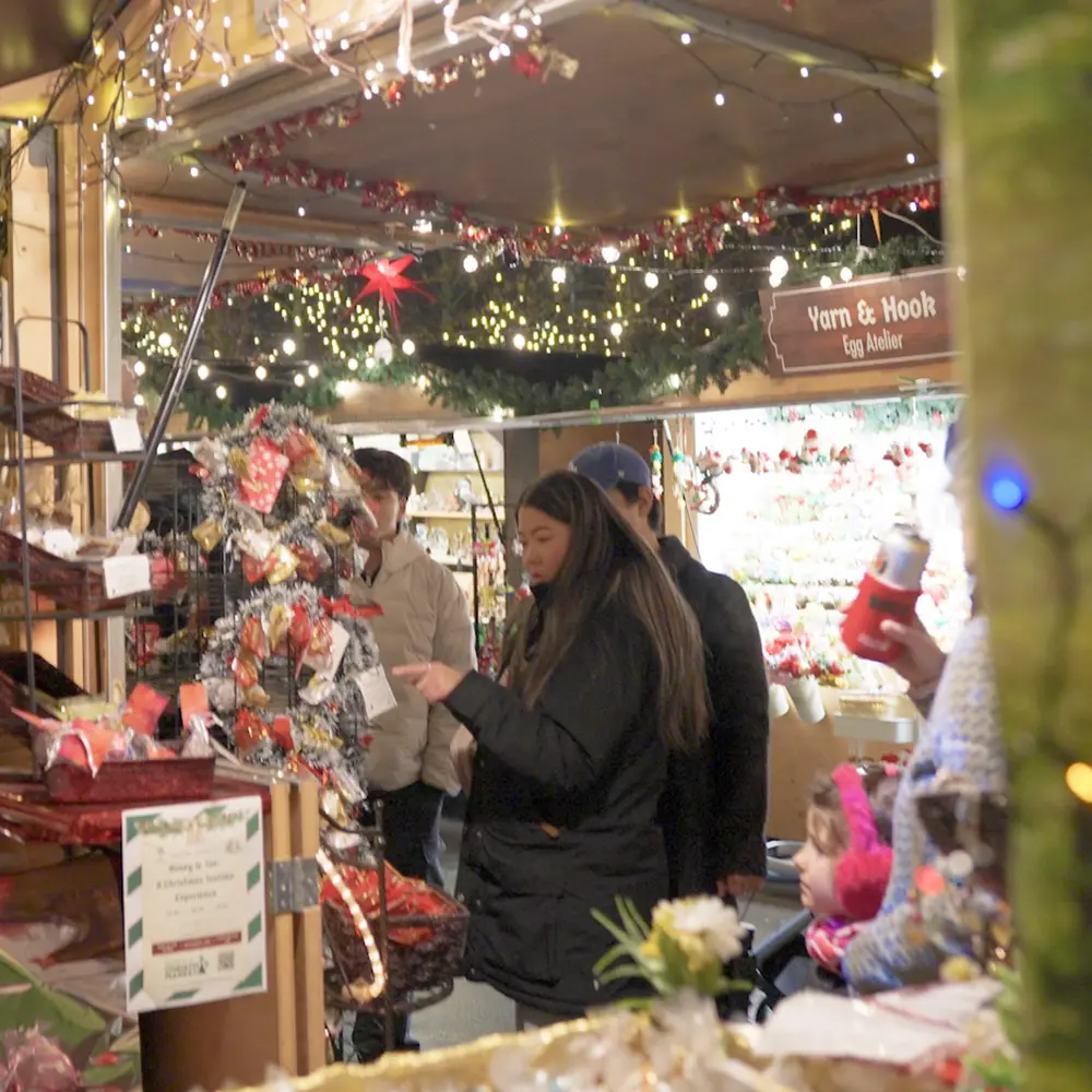 People shopping for gifts at the Seattle Christmas Market.